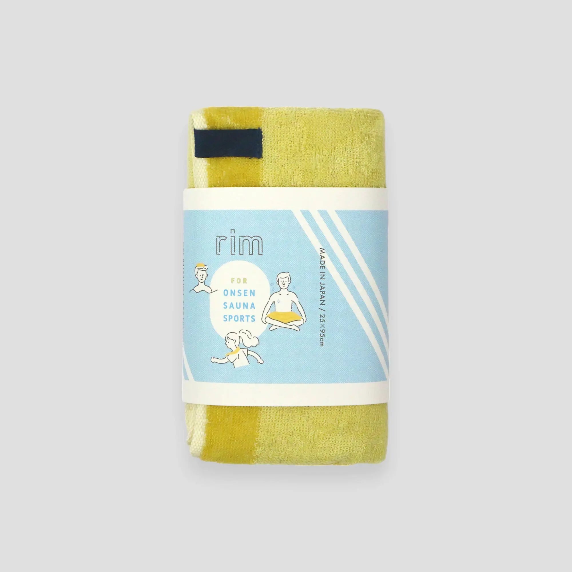 A folded yellow Imabari towel wrapped in a paper band with the name "RIM" on it