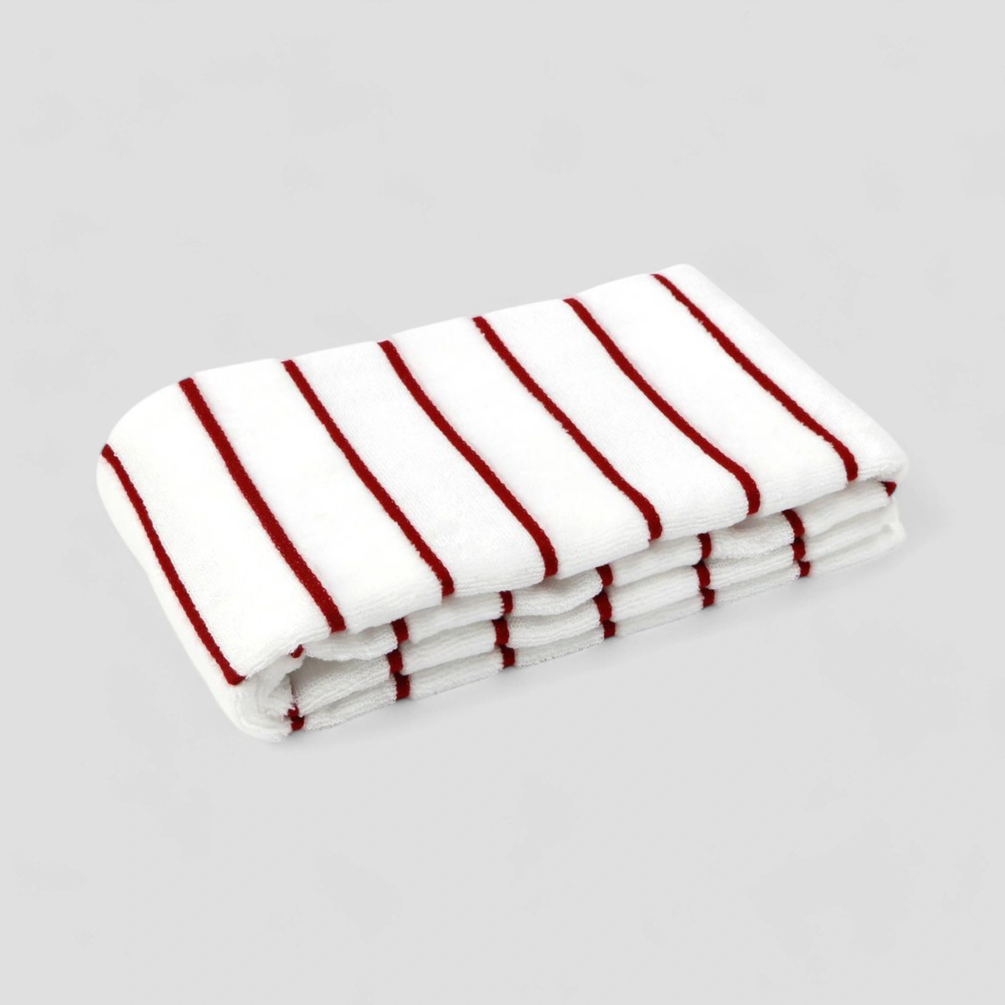 Folded white Imabari towel with red stripe