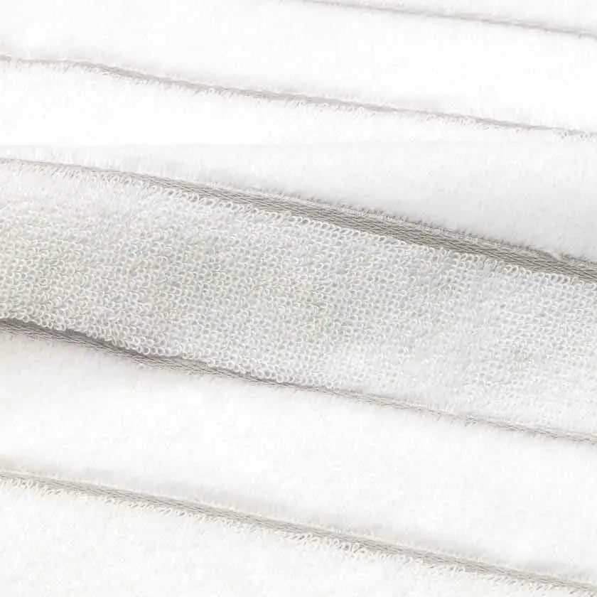 Close-up of the fabric of white Imabari towel with gray stripe.