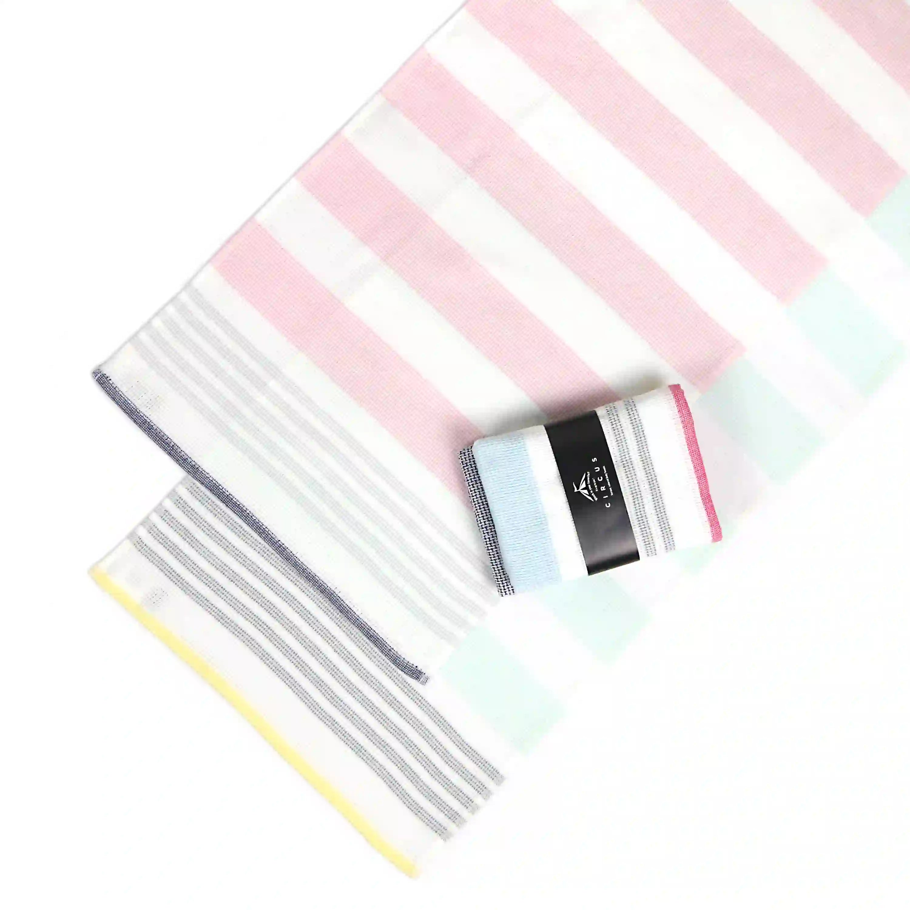A set of colorful striped Imabari towel wash cloths lied and one show the package