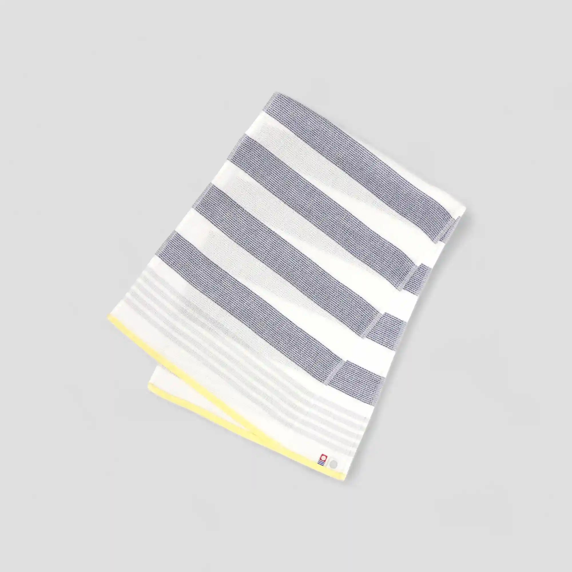 A navy and yellow color striped Imabari towel wash cloths
