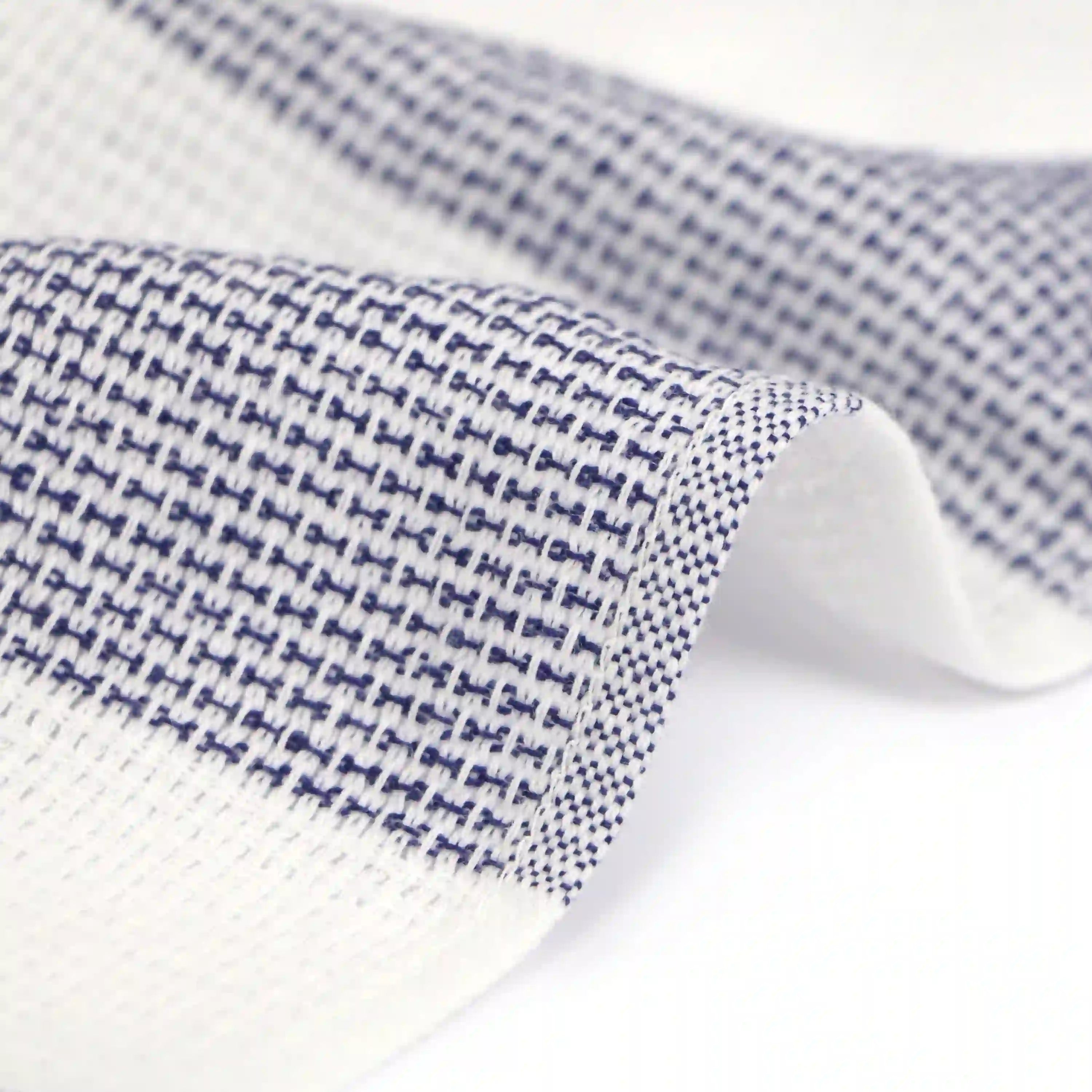 Close-up of a side of a Imabari towel wash cloth on navy pattern