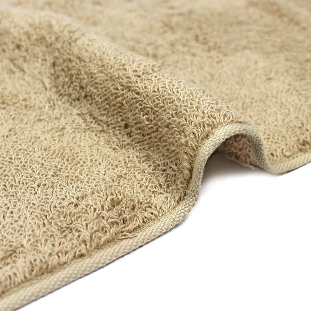 Close-up of a edge of beige Imabari towel made of cotton.