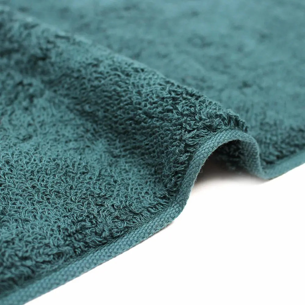 Close-up of a edge of green Imabari towel made of cotton.