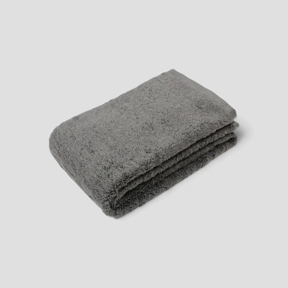 Folded gray Imabari towel on the gray background