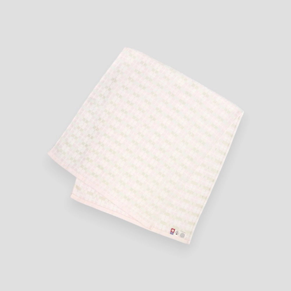 Pink folded ENOWA Imabari towel displayed against a white background, with the brand&