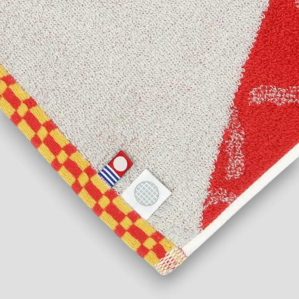 Close-up of labels Imabri towel with red pattern Imabari towel brand mark and IORI&