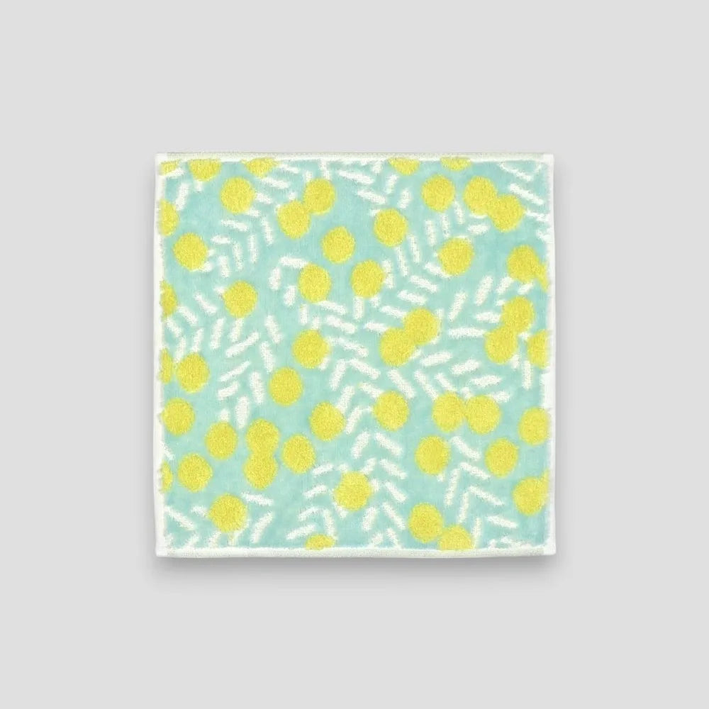 A blue small Imabari towel with yellow floral pattern