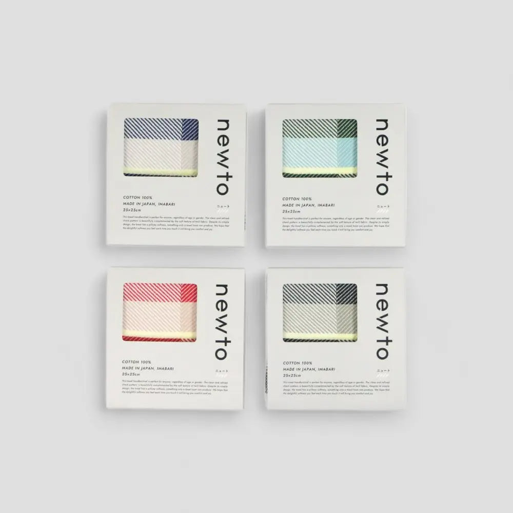 Four mini Imabari towels in different colors displayed in a 2x2 grid, each with the NEWTO brand logo on the bottom.