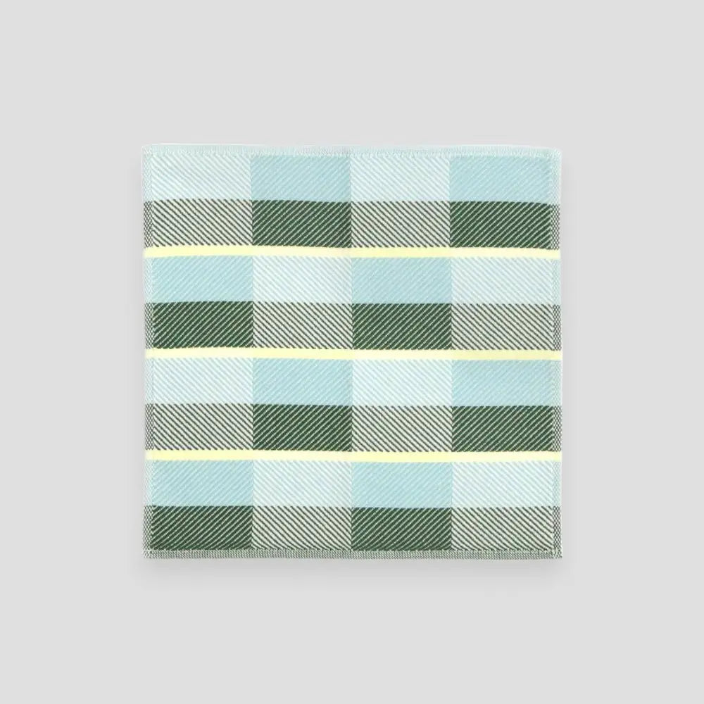 Small Imabari towels in green, blue, and gray displayed