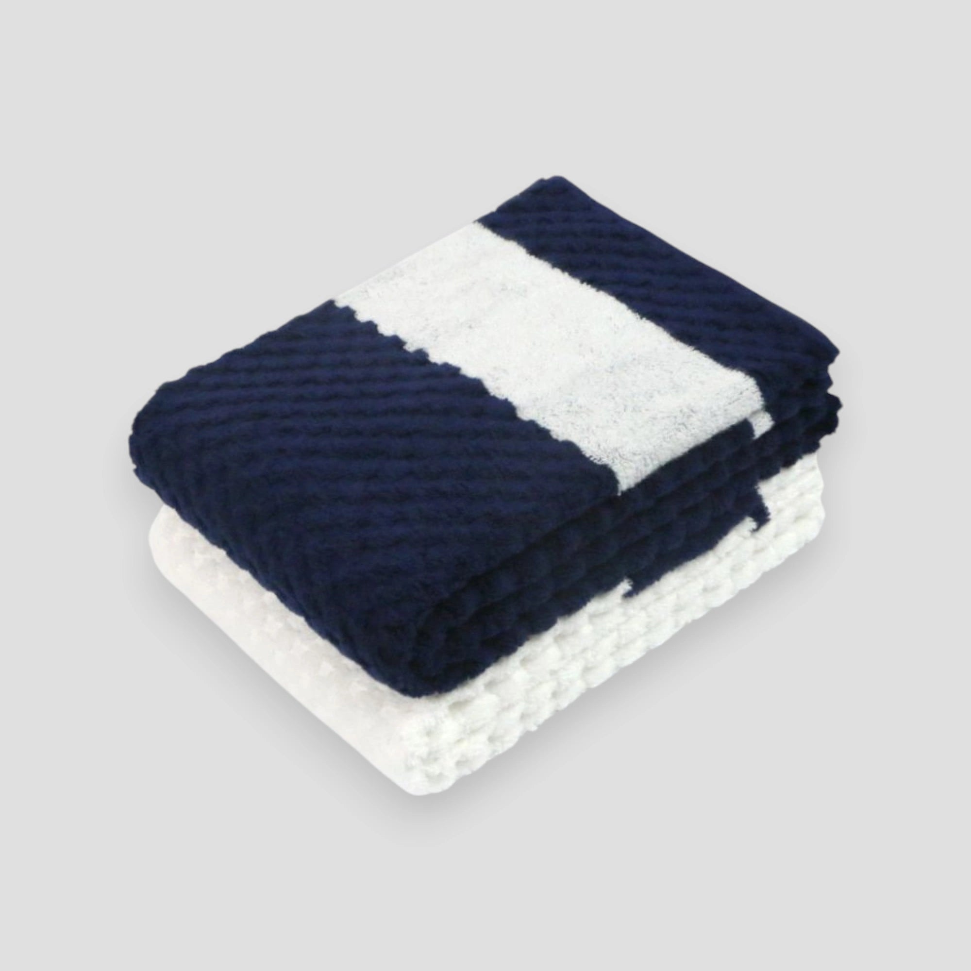 A folded navy and white jacquard weave Imabari towel with a textured design, made of cotton, displayed against a neutral background.
