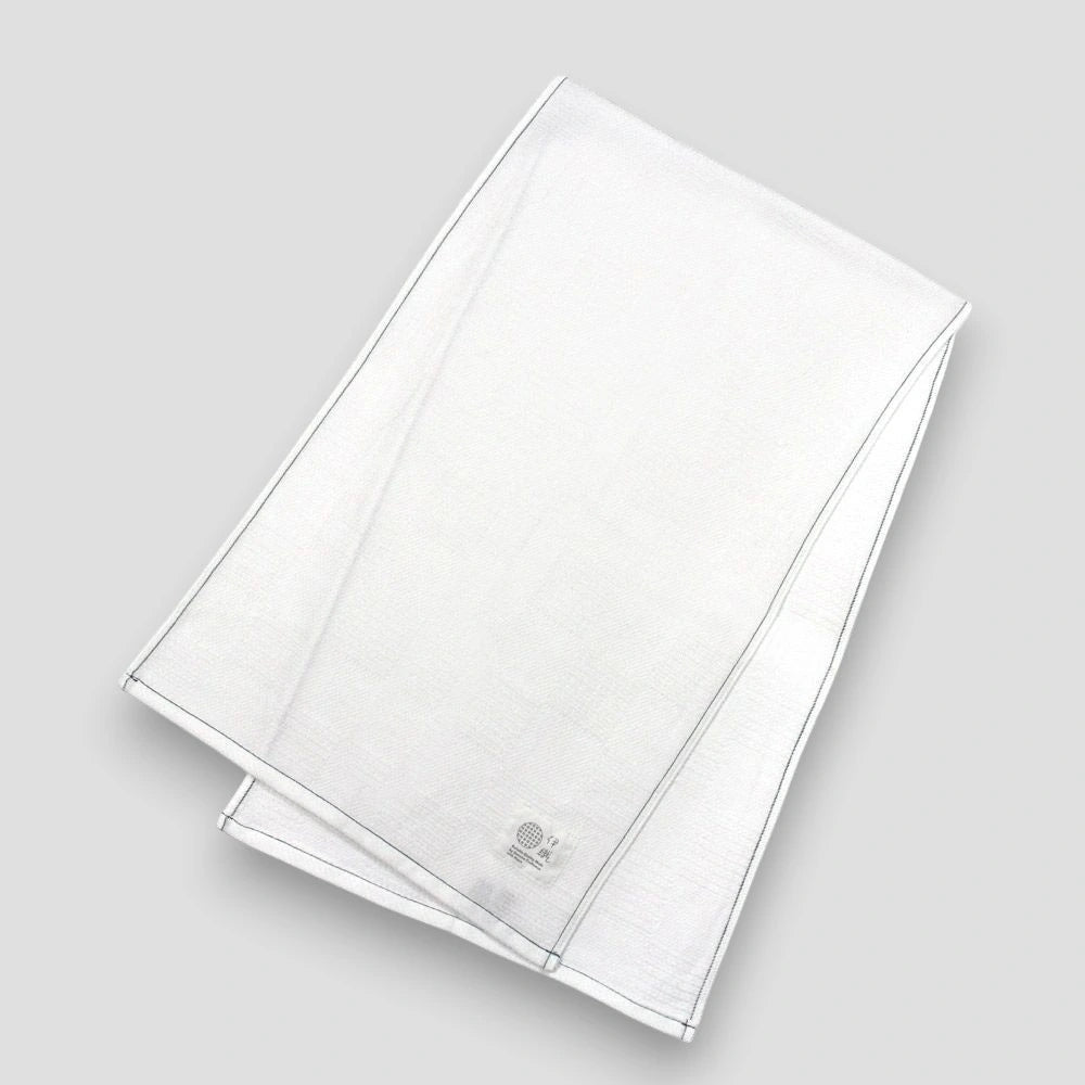 White "Non-Pile" Imabari towel with a brand label on a light gray background