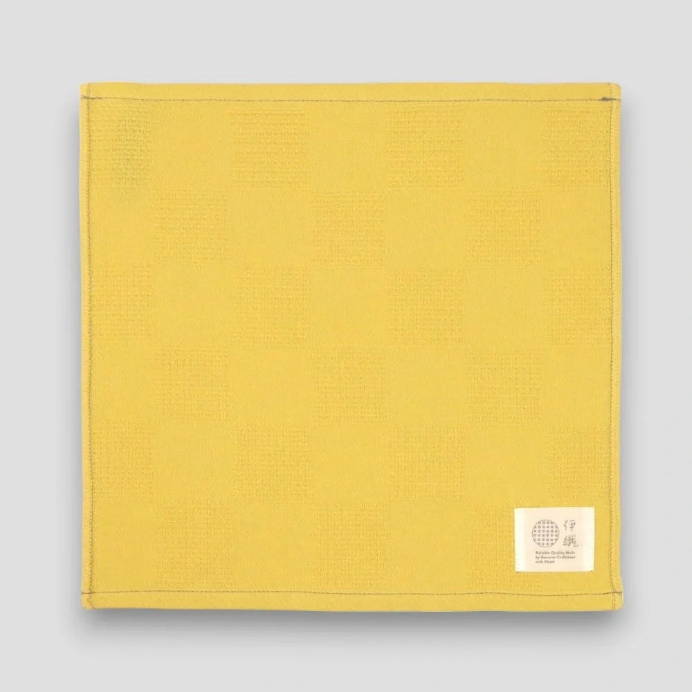 Yellow "Non-Pile" Imabari towel on a light gray background