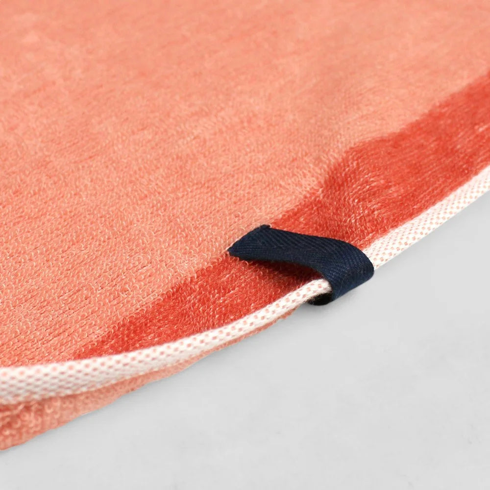 Close-up of the hanging loop on an orange Imabari towel