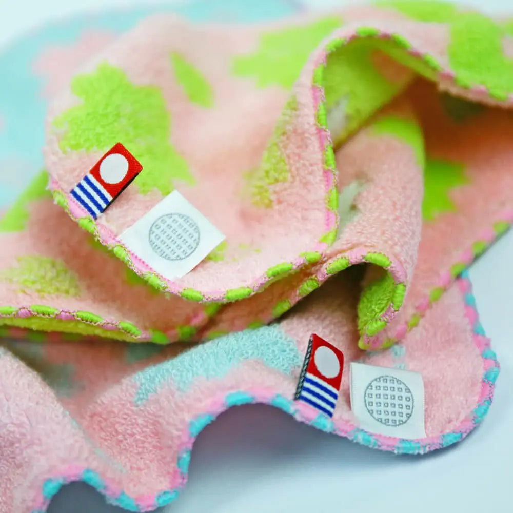 Close-up of Imabari towel labels with Imabari towel brand mark and IORI&