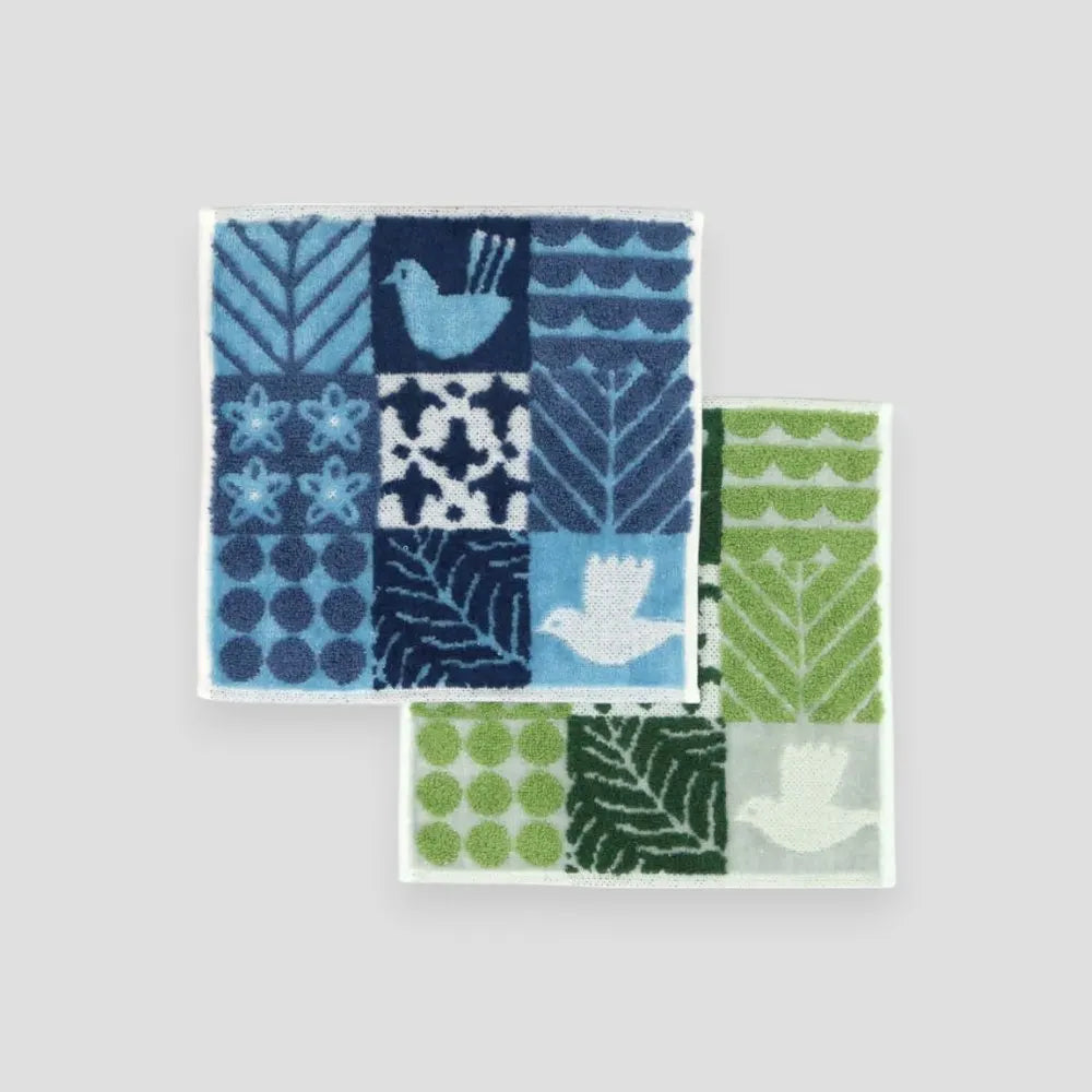 A blue and green birds and floral patterned square Imabari towels displayed