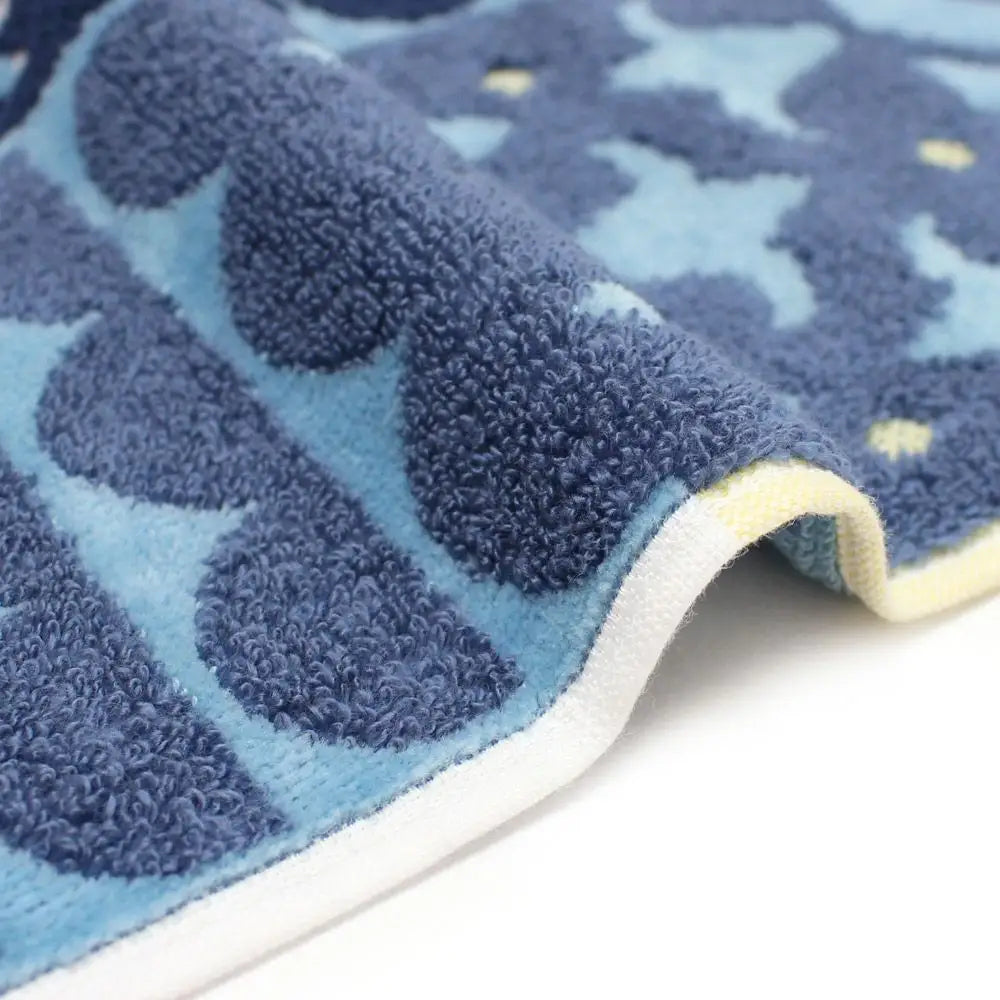 Close-up of a side of blue patterned Imabari towel