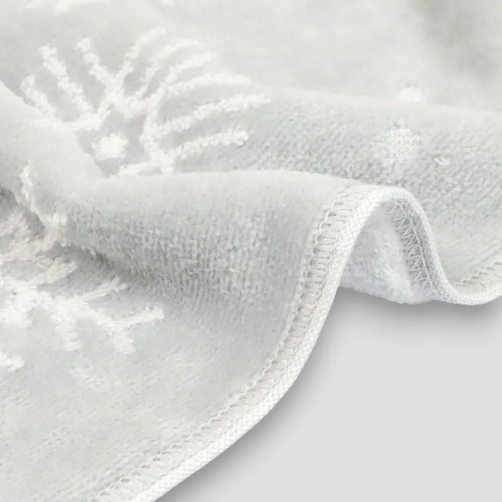 Close-up of a gray Imabari towel corner on a light gray background