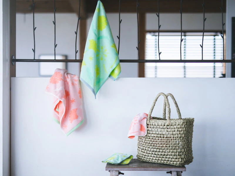 Hanging floral Imabari towels on the wall