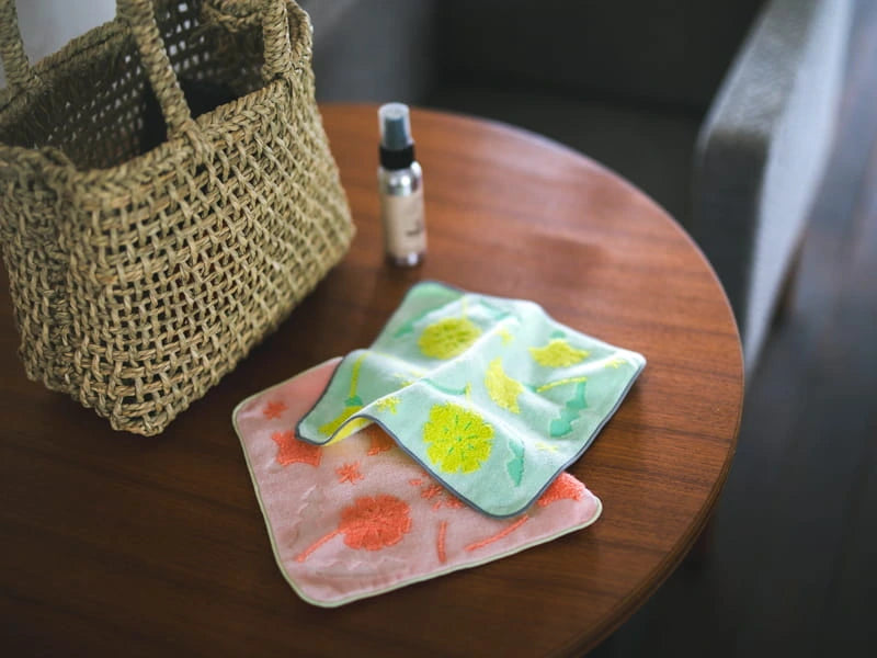 Leave on pink and yellow square Imabari towel with floral pattern