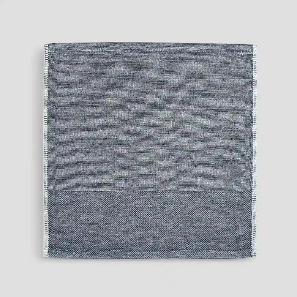 Navy Imabari towel with a subtle herringbone pattern on a light gray background.