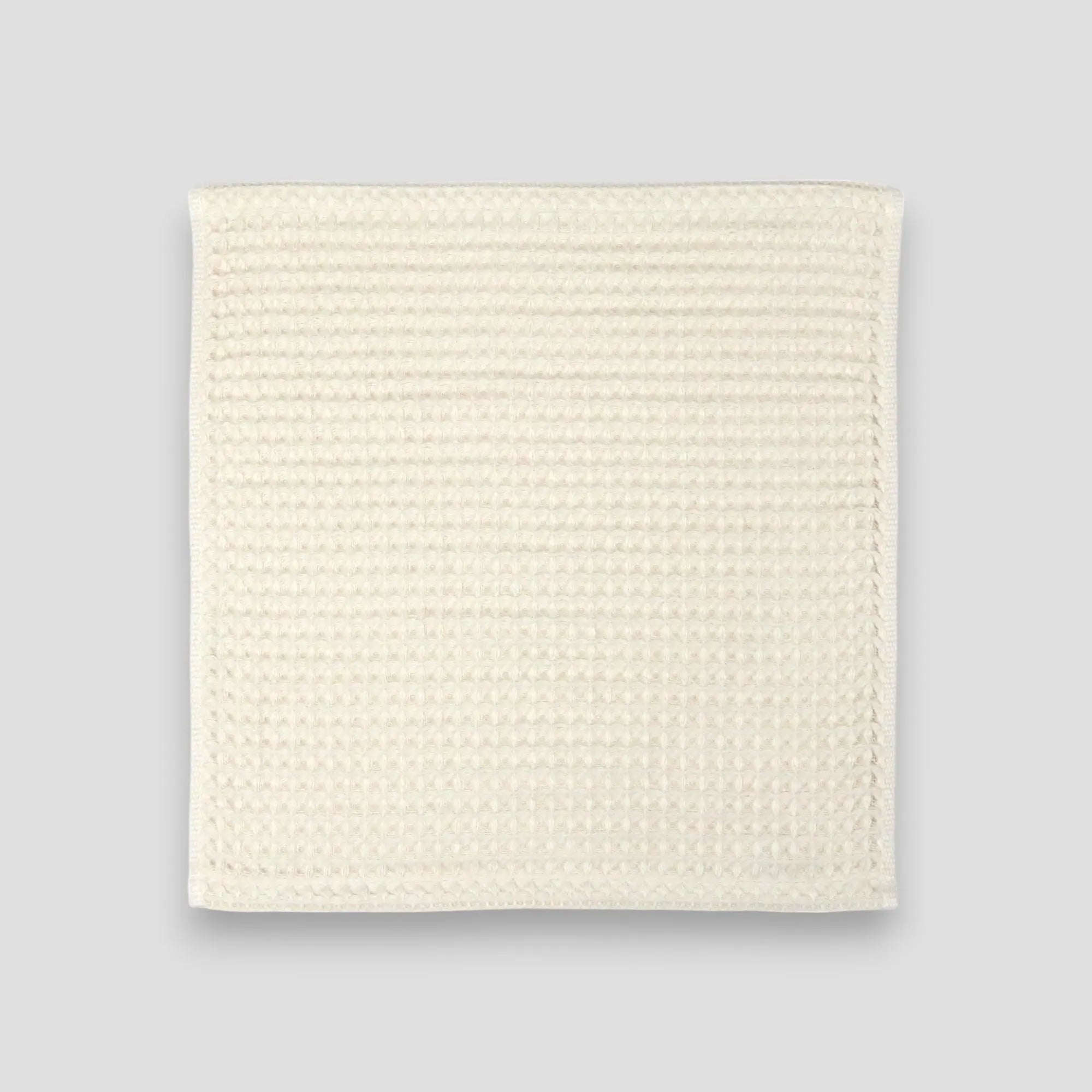 Off-white waffle Imabari towel on a gray background