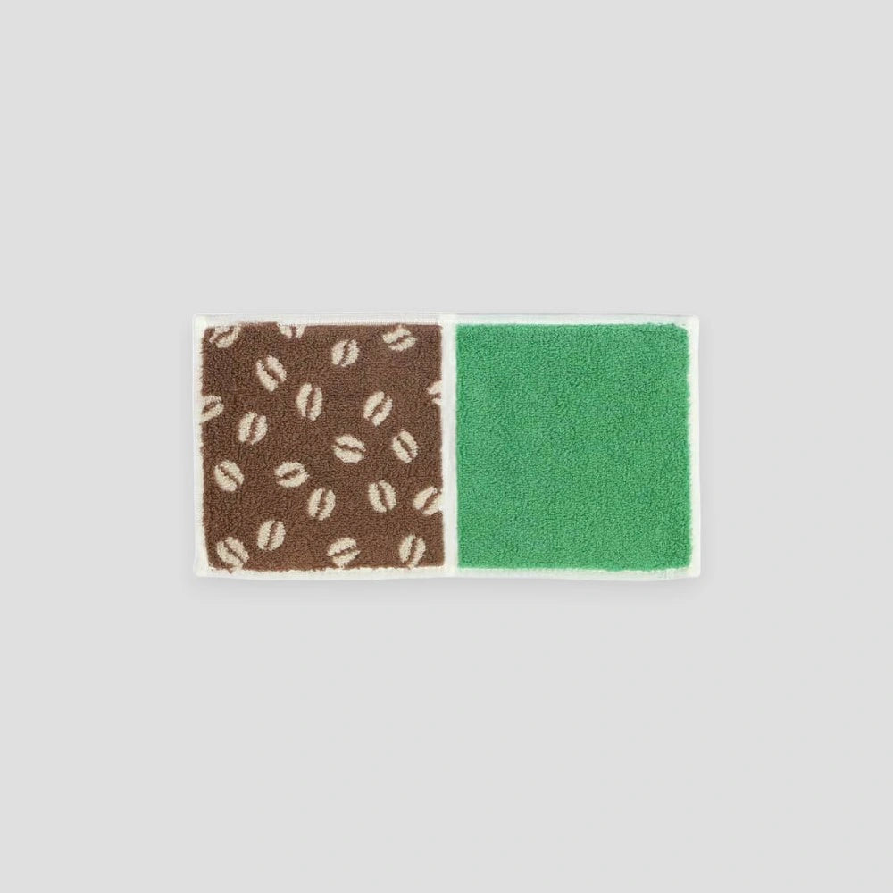 A compact Imabari towel in beige coffee beans patterns, displayed against a white background.