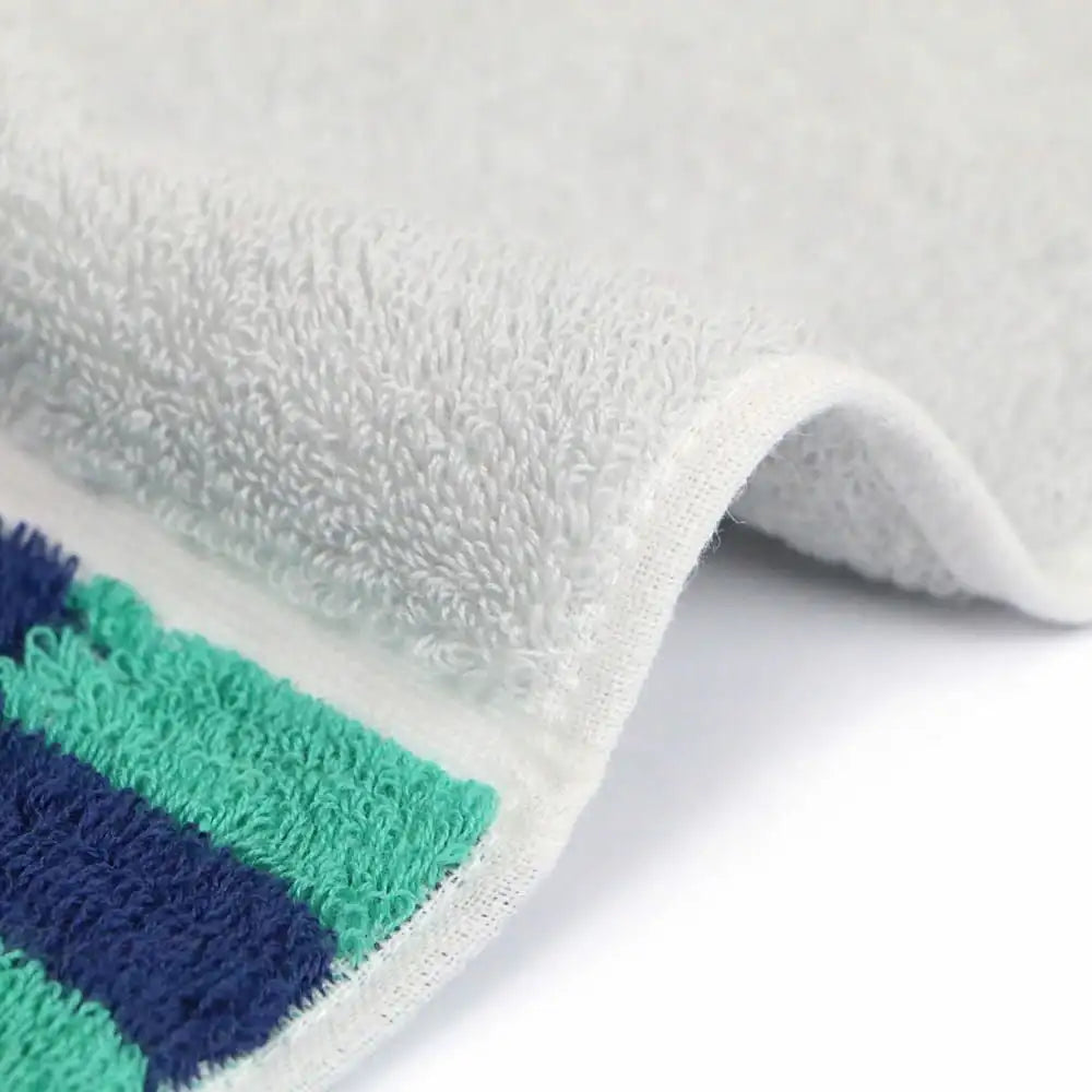 Close up of a side of a compact Imabari towel in vibrant patterns