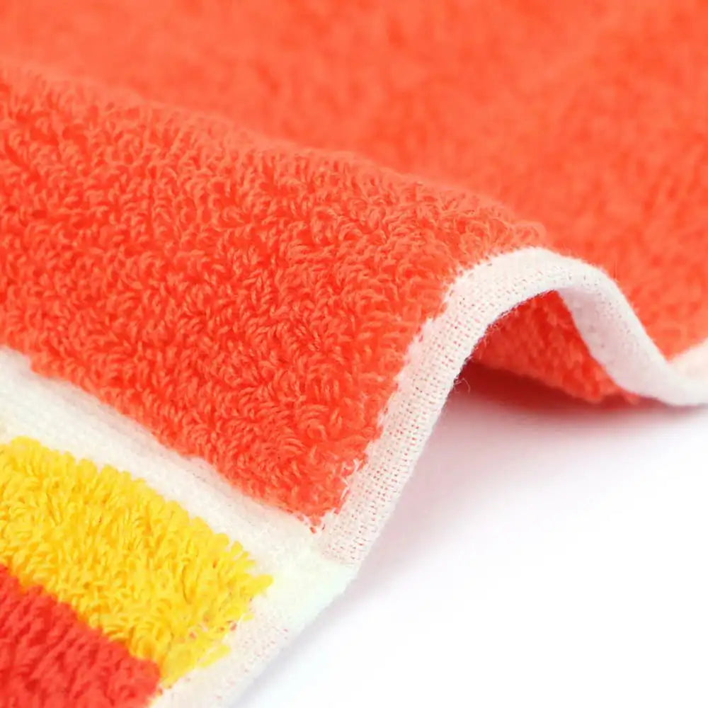 Close up of a side of a compact Imabari towel in vibrant patterns