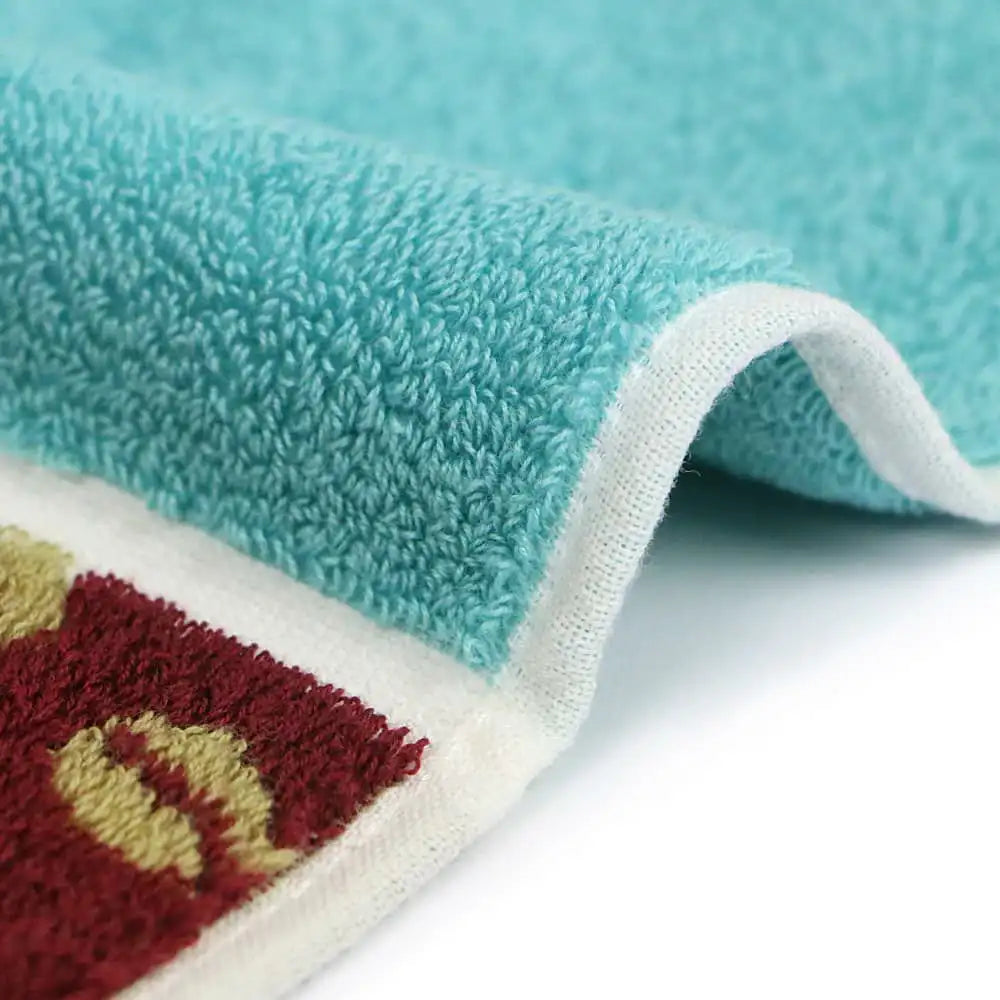 Close up of a side of a compact Imabari towel in vibrant patterns