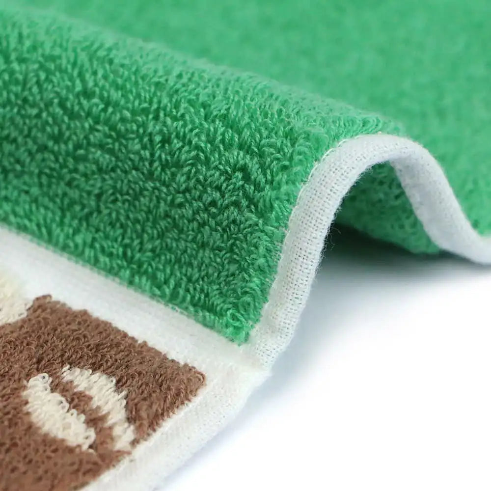 Close up of a side of a compact Imabari towel in vibrant patterns