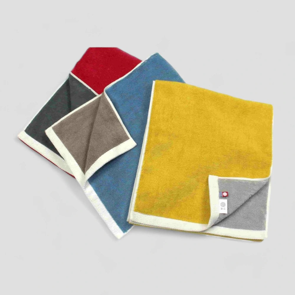 A close-up of a reversible Imabari towel in different colors