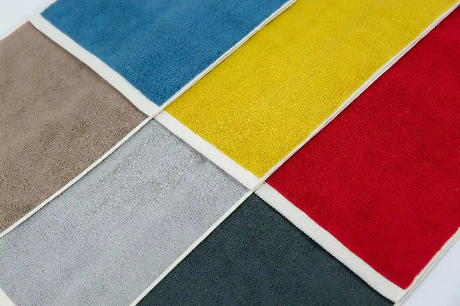 Various colors of reversible Imabari towels laid out flat