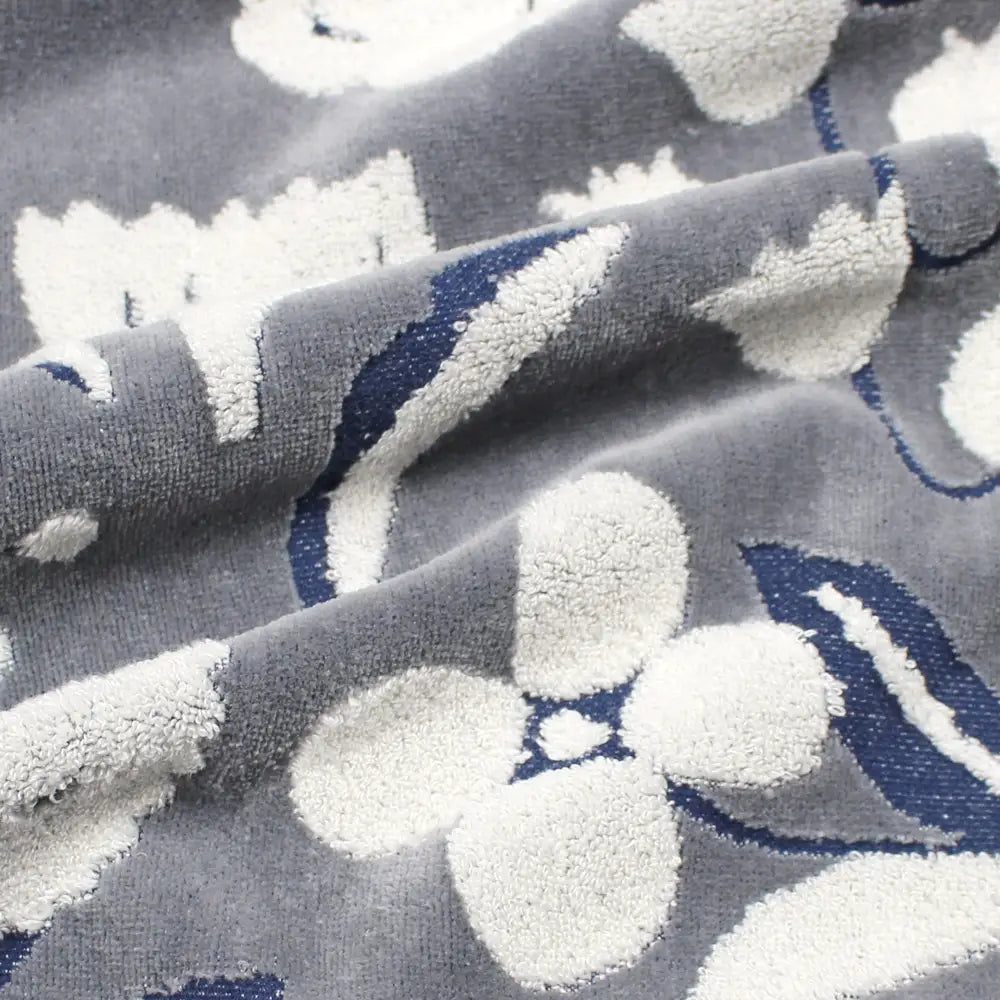 Close-up of a dark gray Imabari towel with a jacquard floral pattern