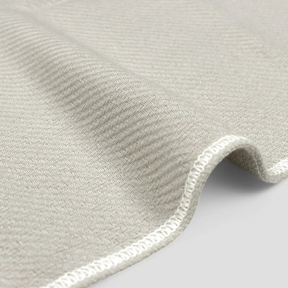 Close-up of a side of gray Imabari towel made from cotton gauze.
