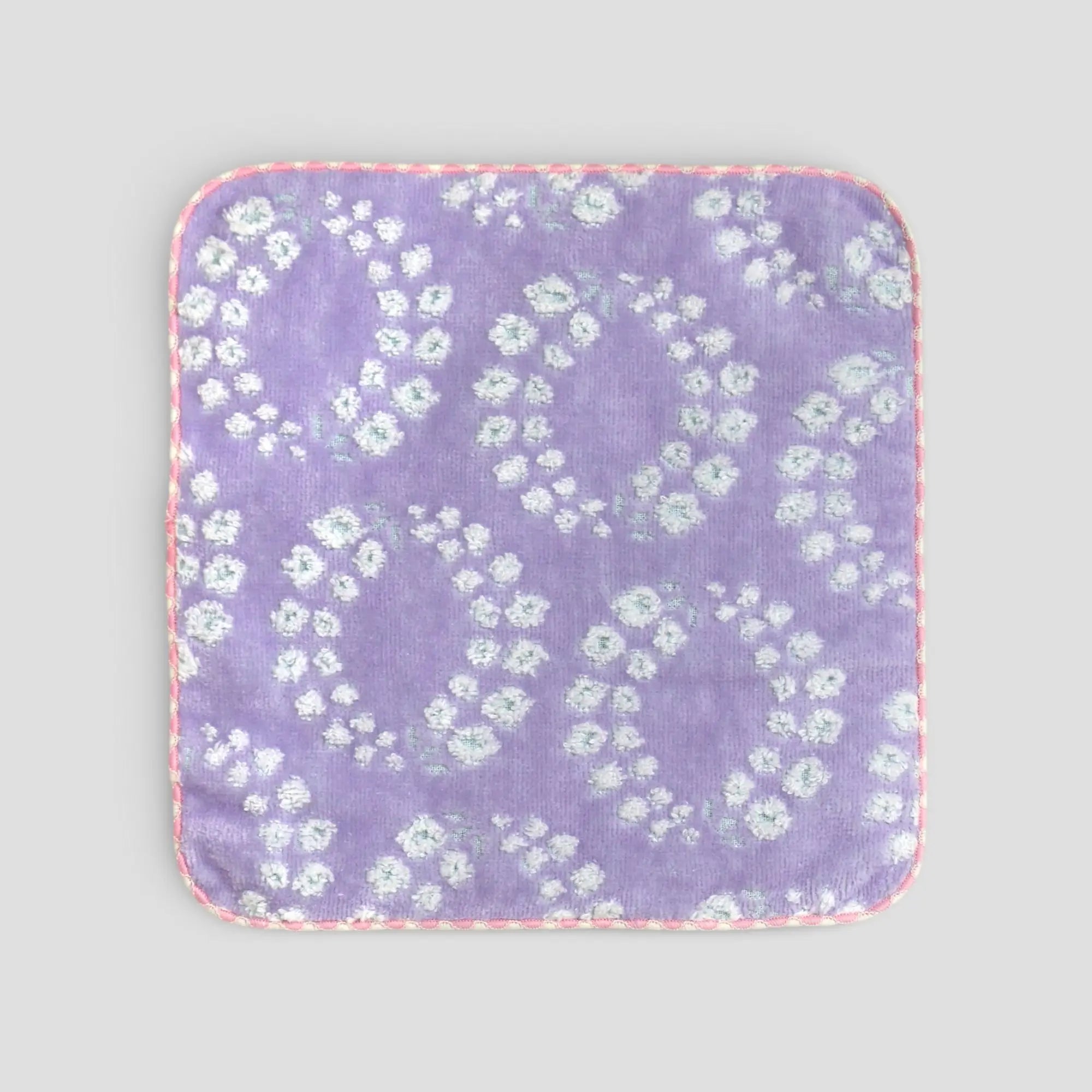 Floral-patterned Imabari towel on a light gray background