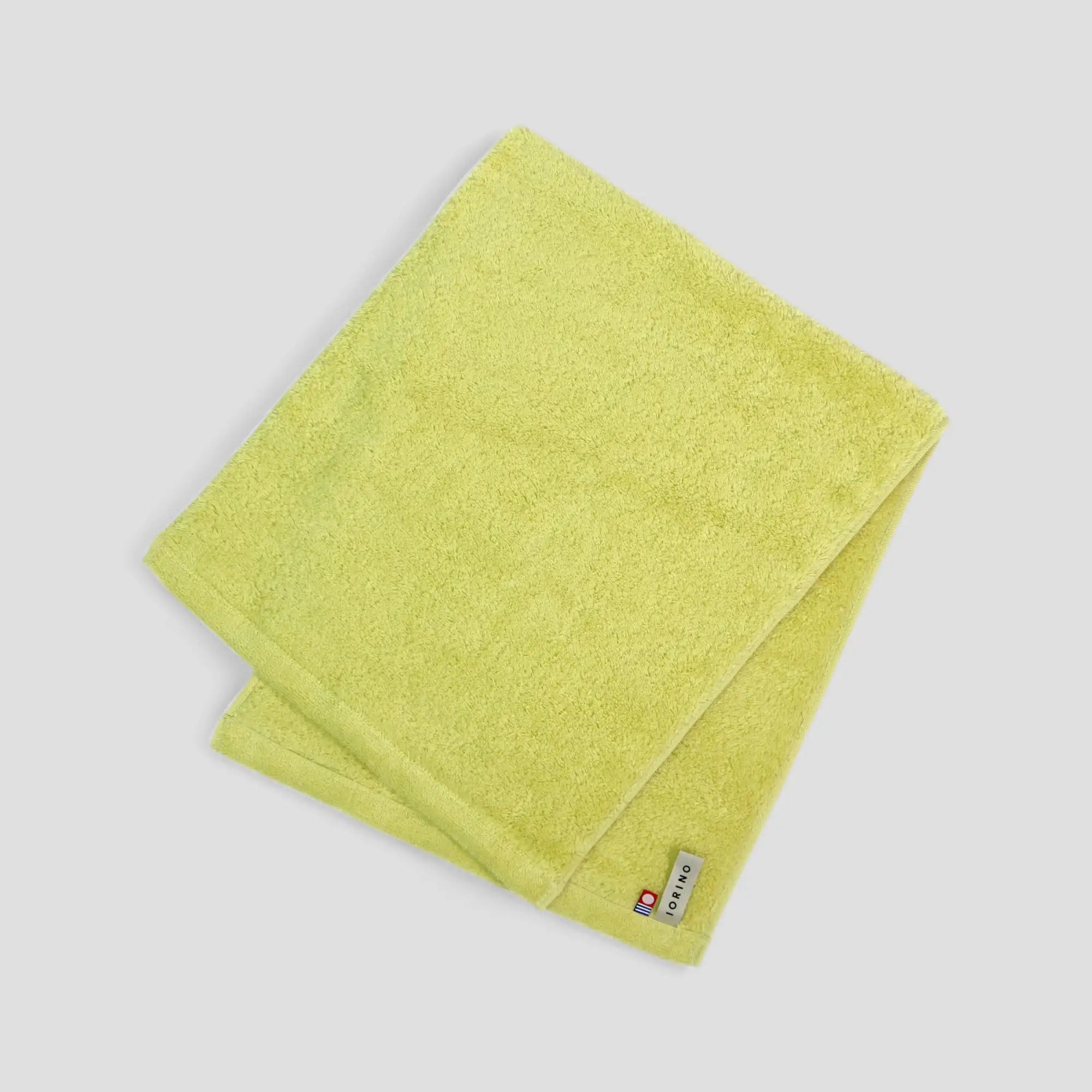 Green Imabari towel on a light gray background