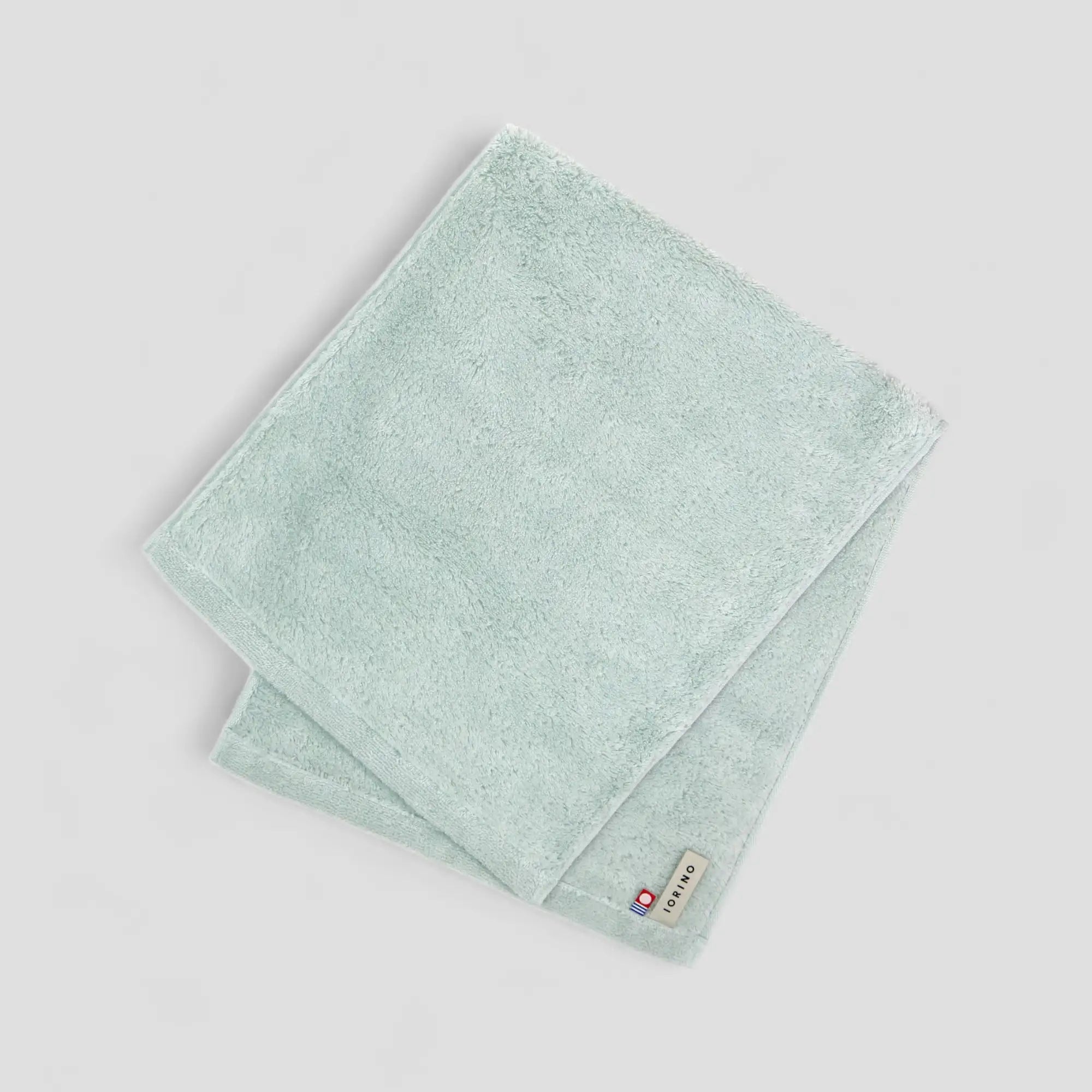 Light blue Imabari towel on a light gray background