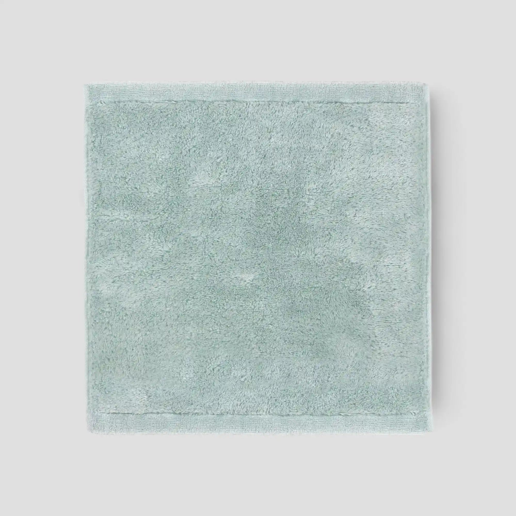 Light blue Imabari towel on a light gray background