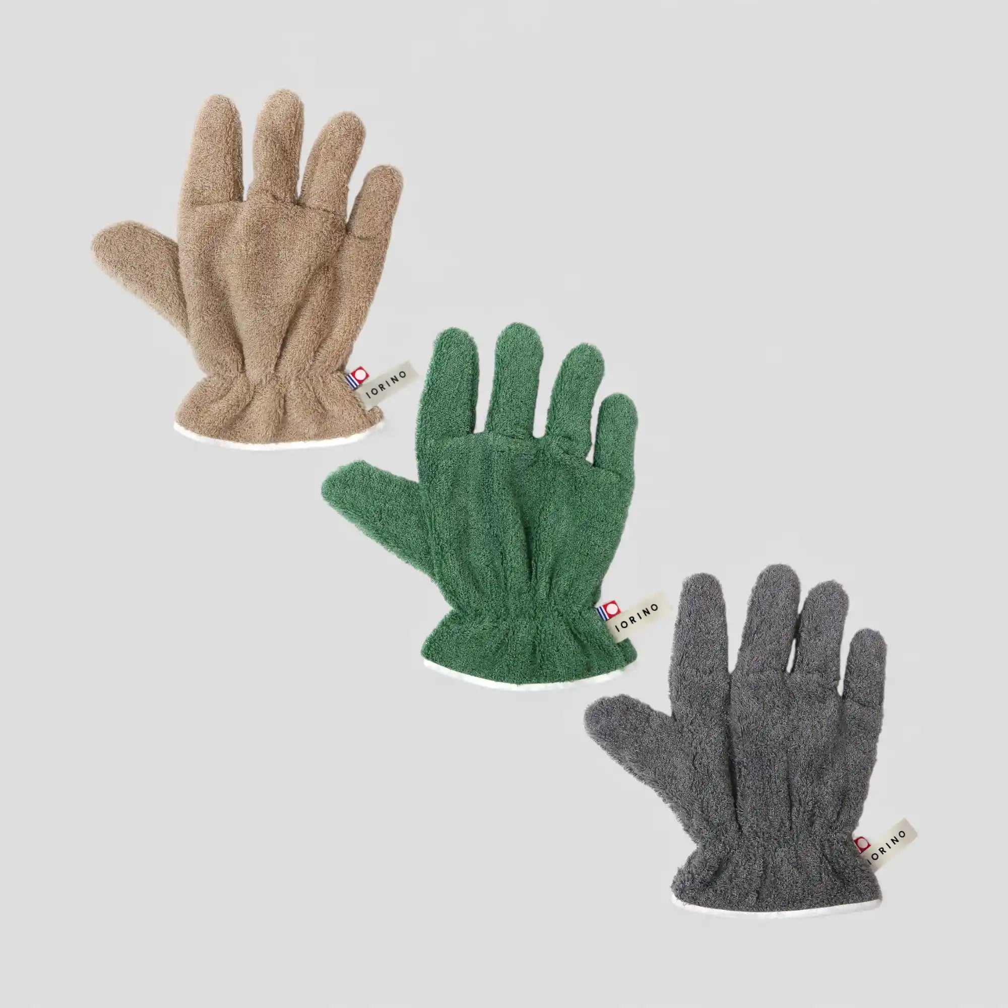 Three pairs of Imabari towel gloves for hair dry in beige, green, and gray on a light gray background.