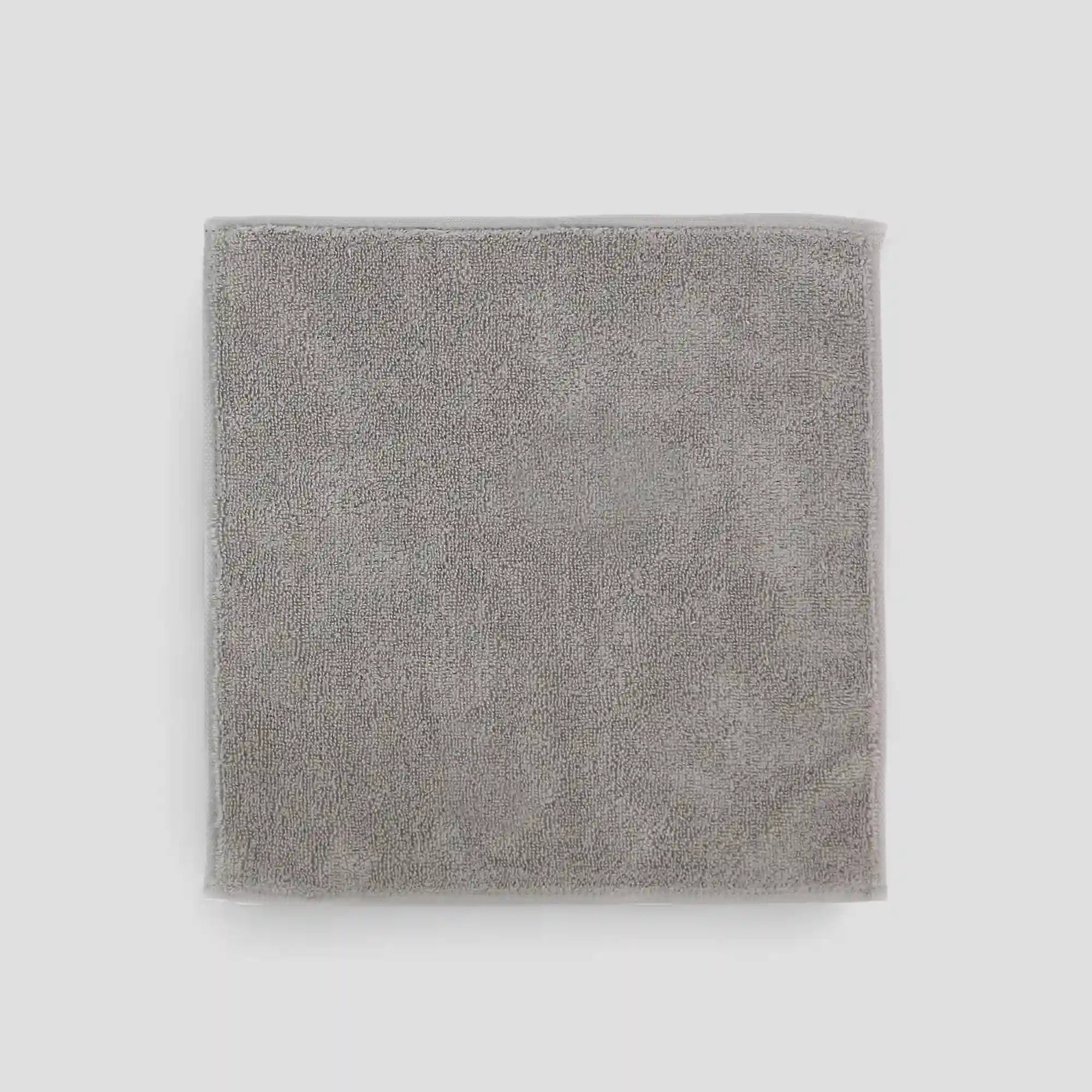 Gray Imabari towel on a light gray background