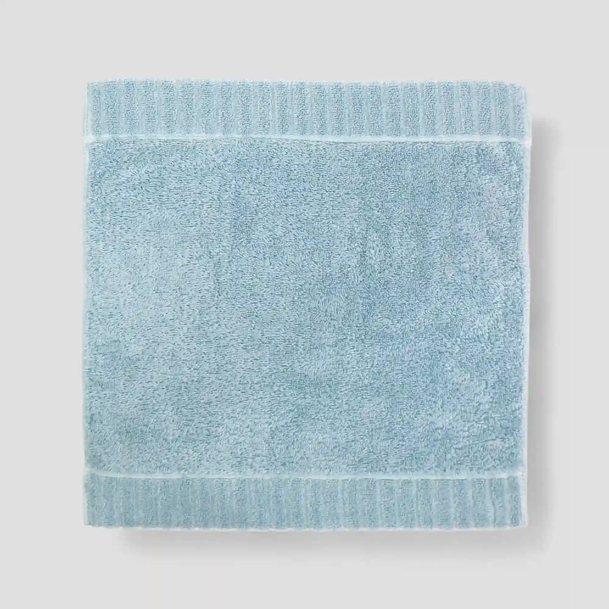 Light blue Imabari towel on a light gray background
