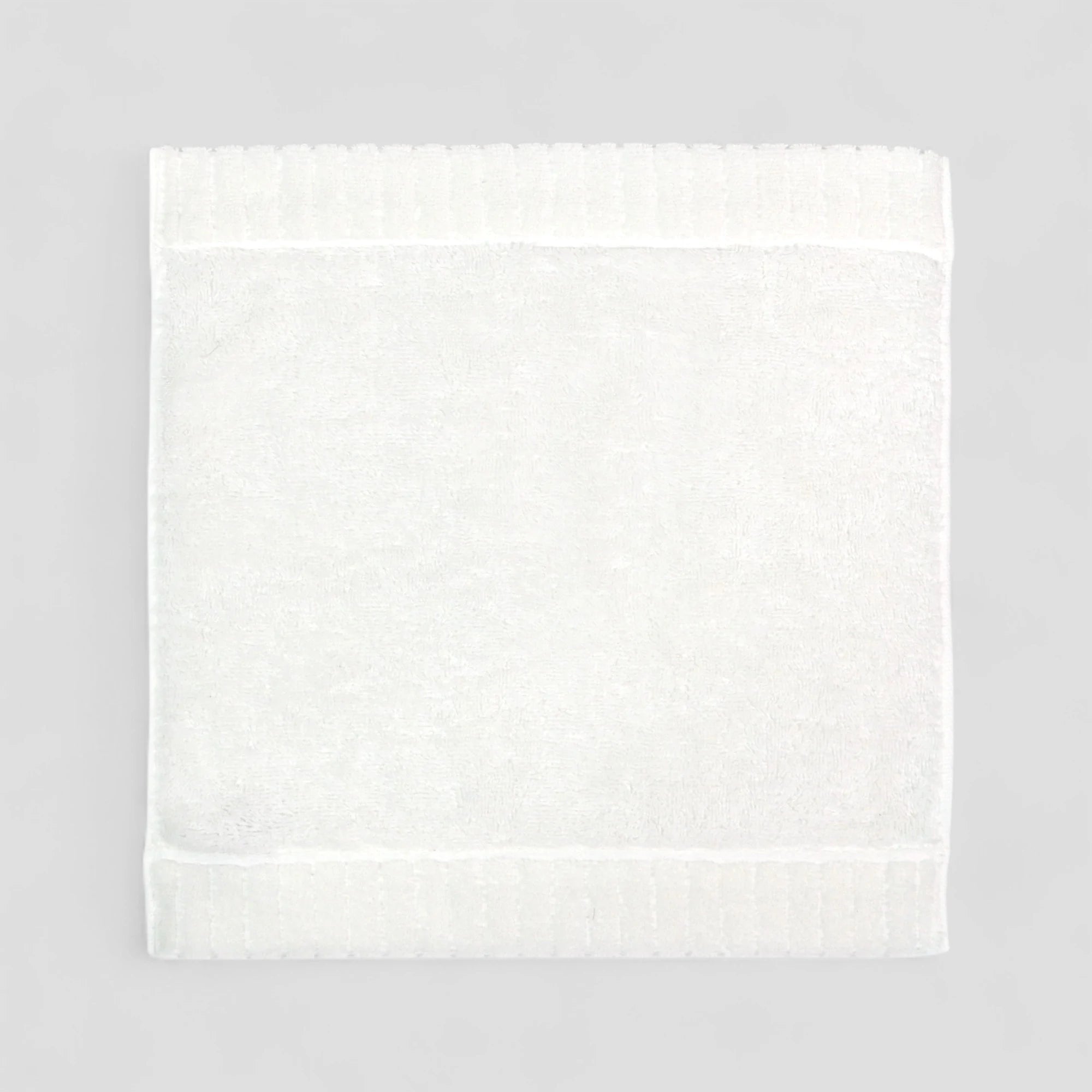 White Imabari towel on a gray background