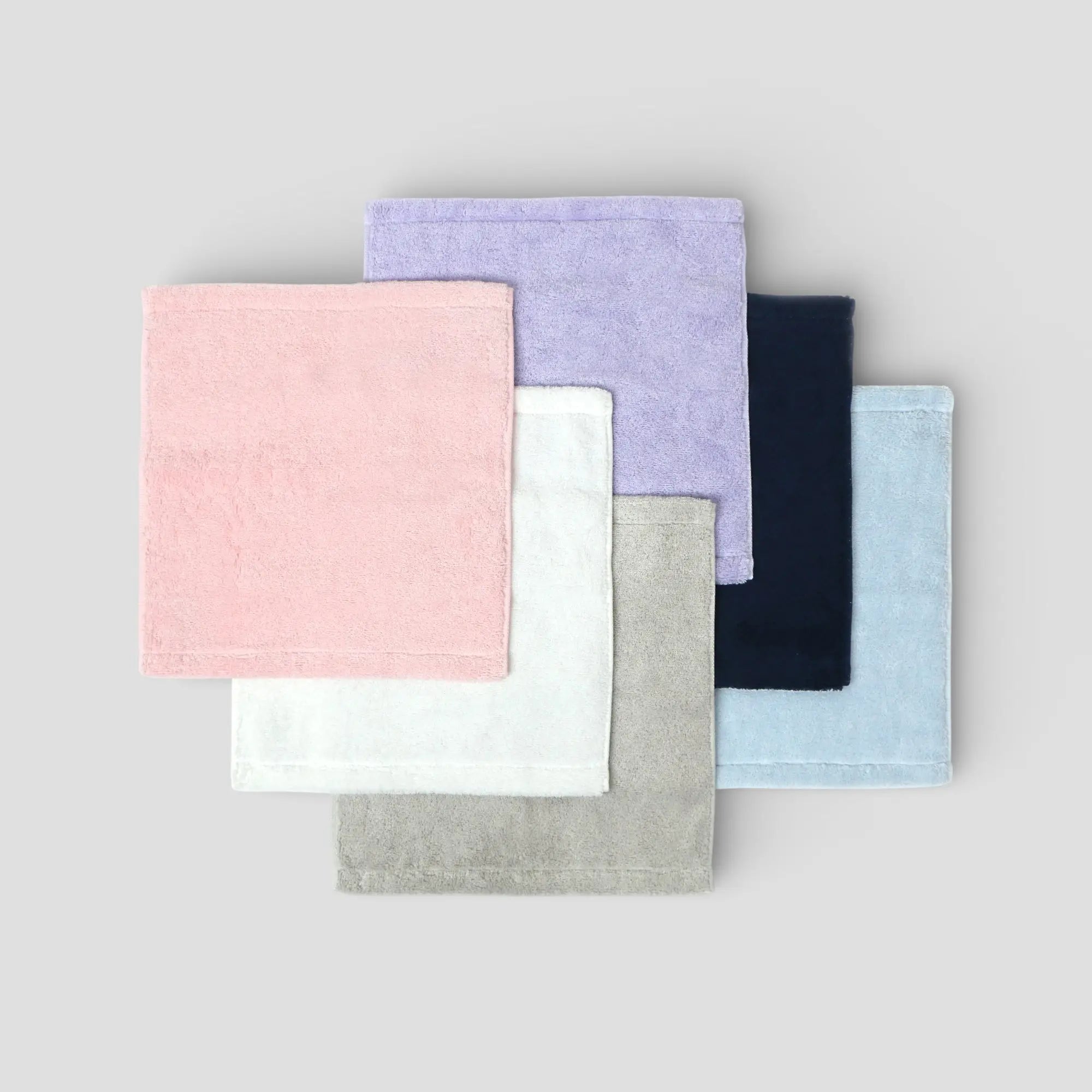 Set of colorful fabric Imabari towels on a gray background
