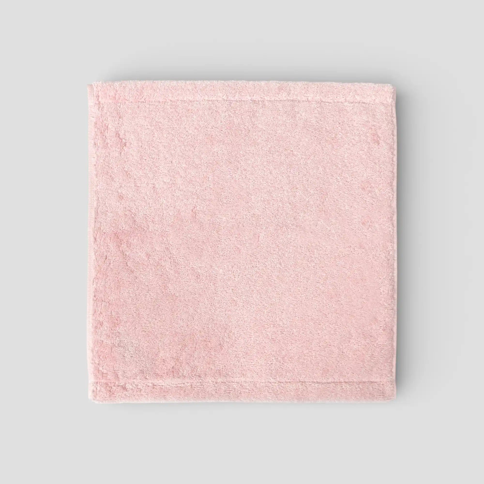 Pink Imabari towel on a gray background