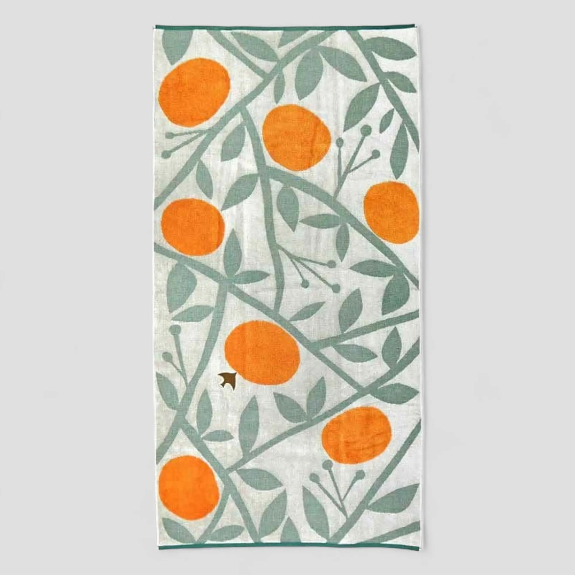 Imabari towel with orange, bird and leaf pattern on a white background