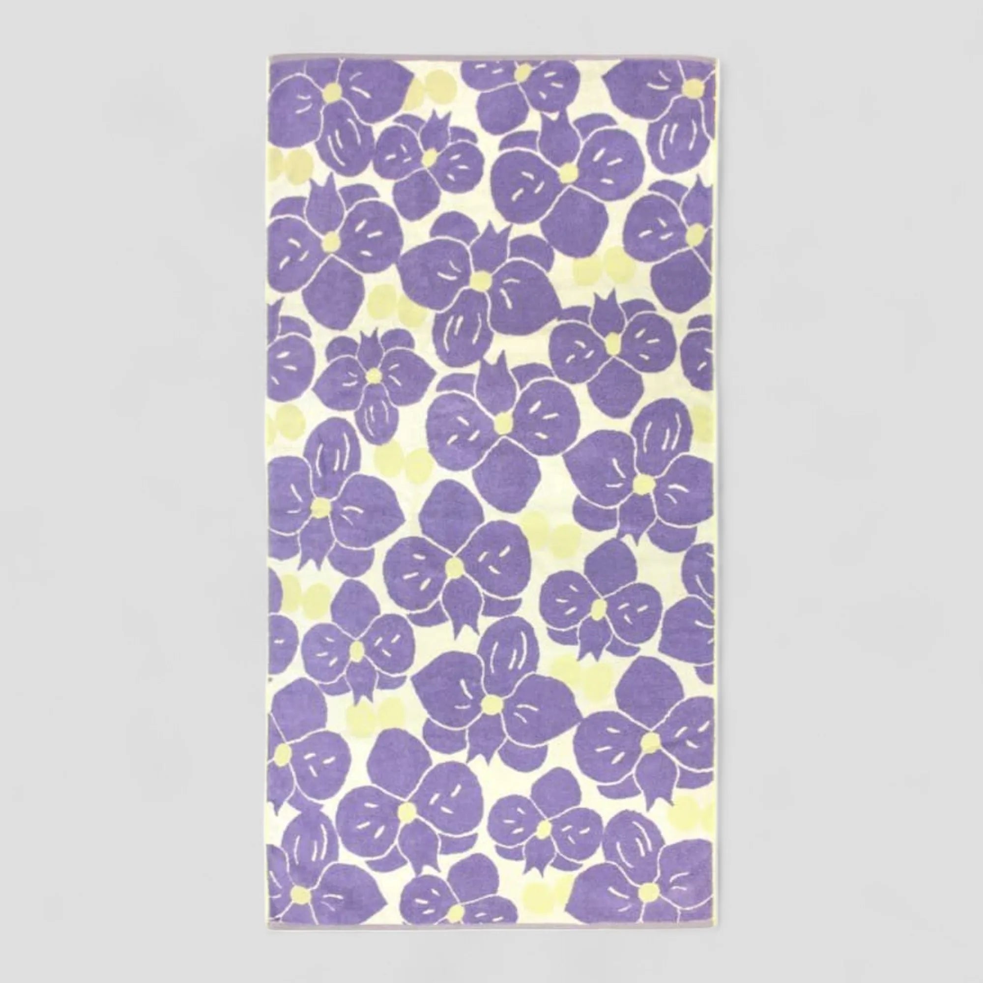 Floral patterned Imabari towel with purple flowers on a light gray background