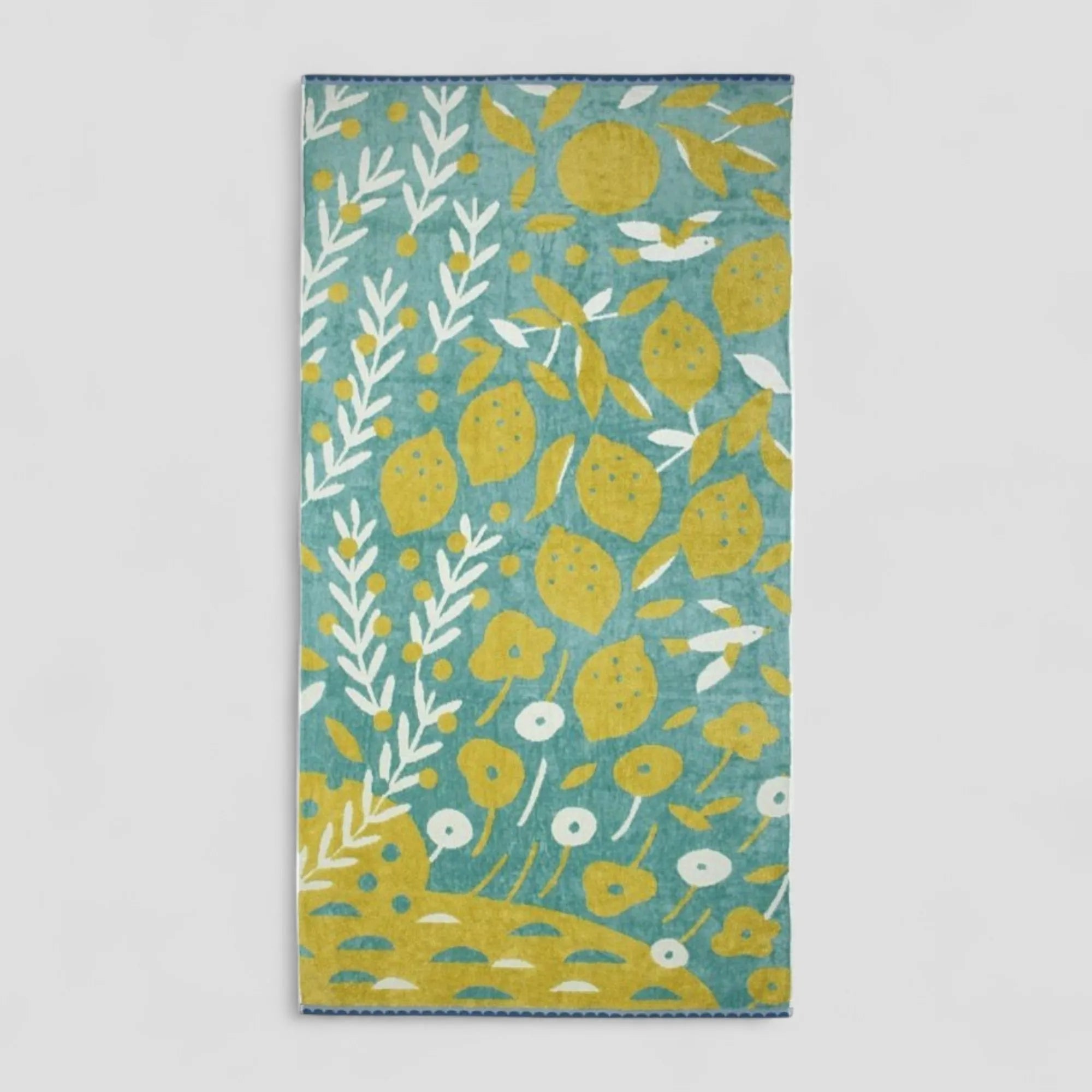 Imabari towel with yellow lemon pattern on a light gray background