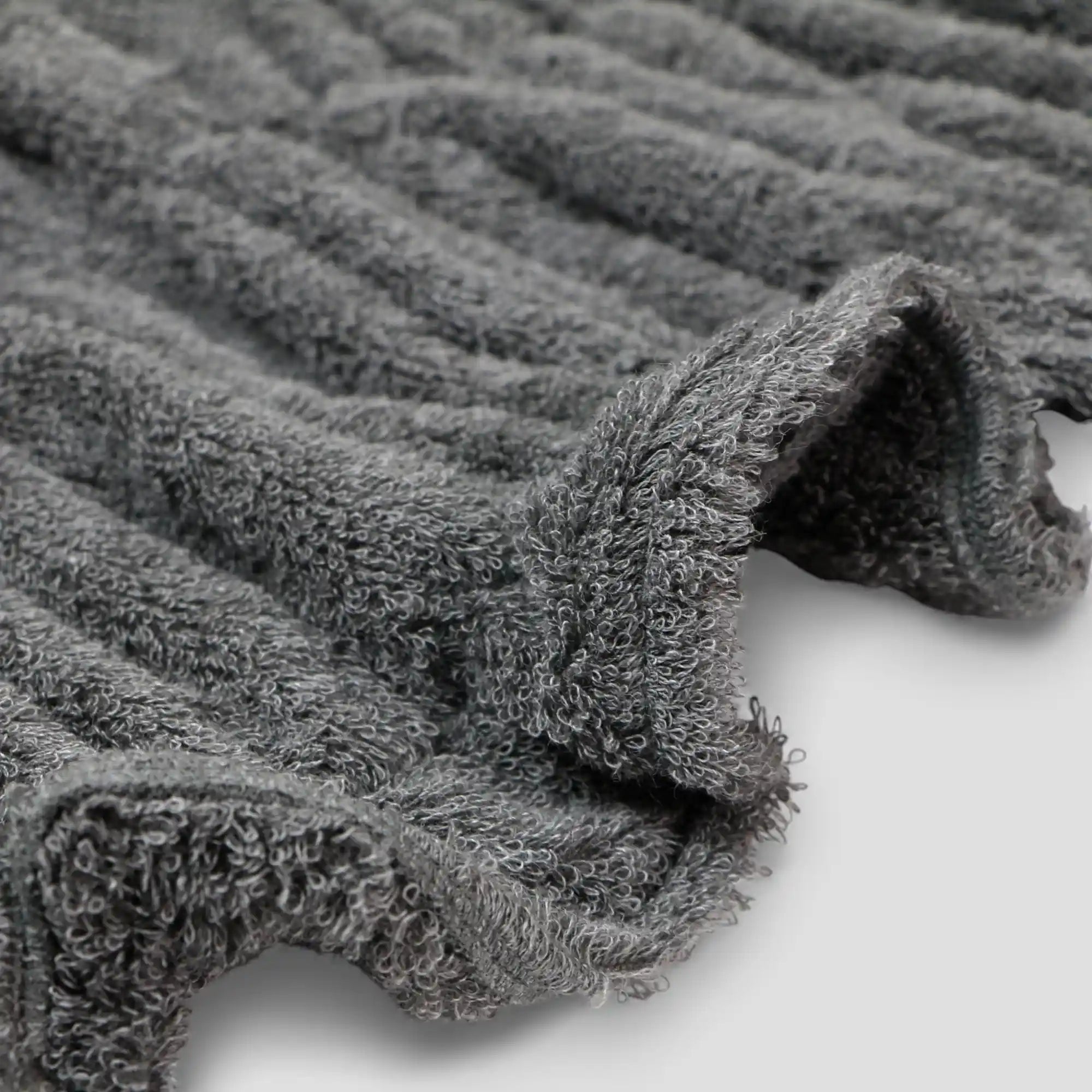 Close-up of gray textured Imabari towel fabric on a light background