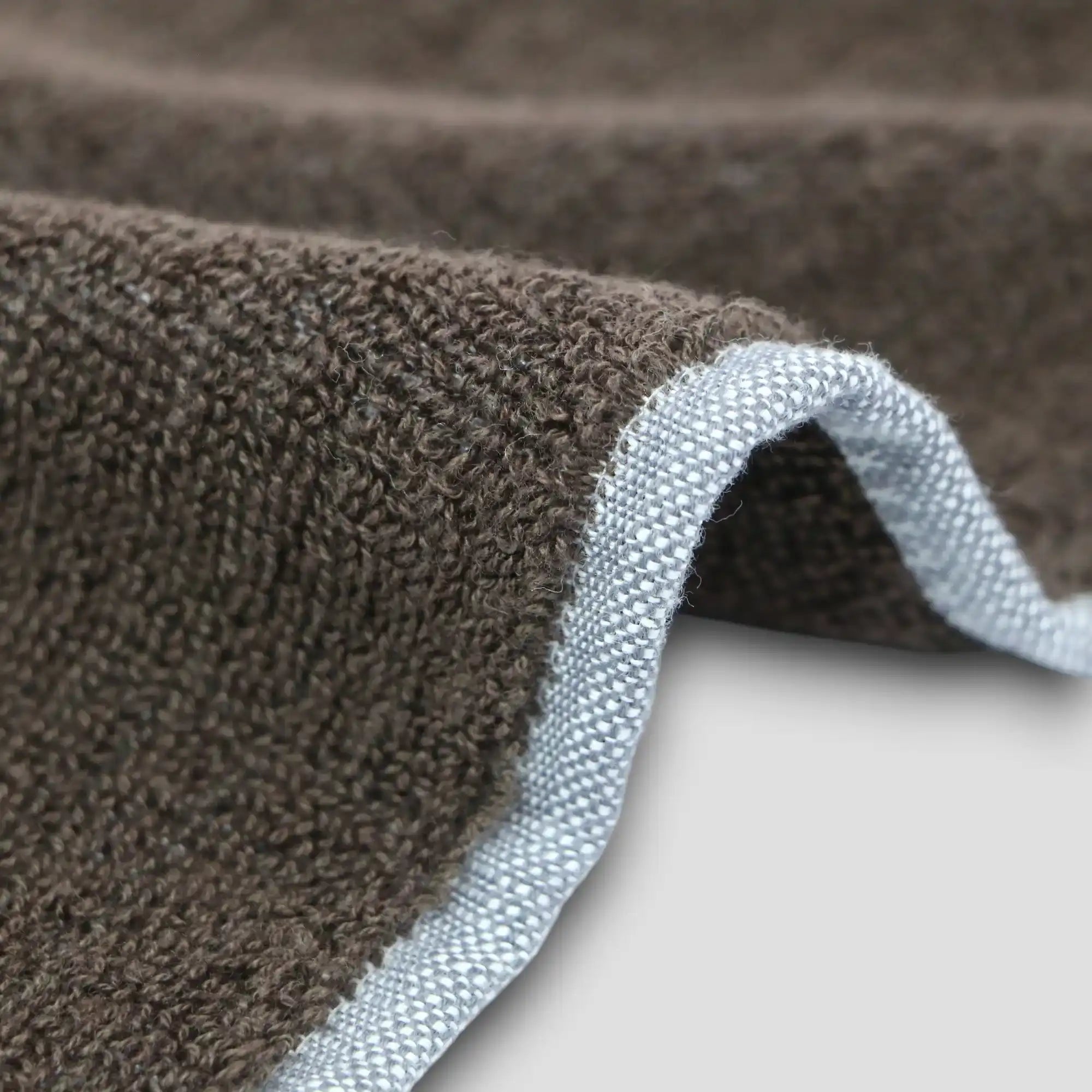 Close-up of a side of charcoal gray Imabari towel